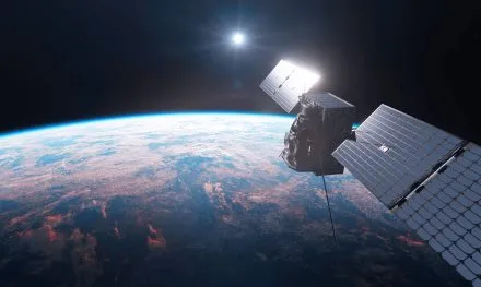 High-resolution image of Unseenlabs' next-generation satellite orbiting Earth. The satellite, equipped with advanced solar panels and state-of-the-art RF detection technology, operates against the backdrop of space with the sun shining brightly and Earth's curvature visible below. © Unseenlabs