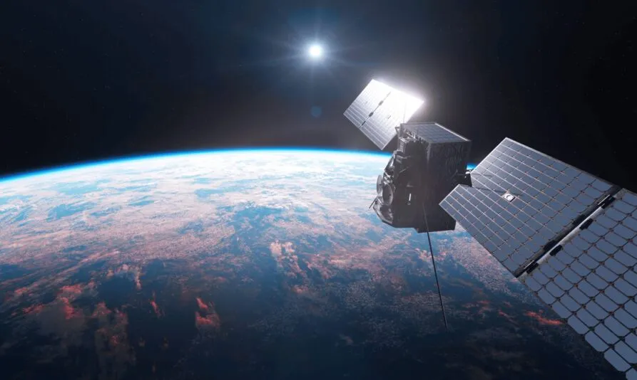 High-resolution image of Unseenlabs' next-generation satellite orbiting Earth. The satellite, equipped with advanced solar panels and state-of-the-art RF detection technology, operates against the backdrop of space with the sun shining brightly and Earth's curvature visible below. © Unseenlabs