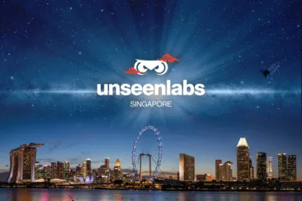 Unseenlabs logo above the illuminated Singapore skyline at night, featuring Marina Bay Sands and the Singapore Flyer, with a satellite in orbit symbolizing space-based technology. © Unseenlabs