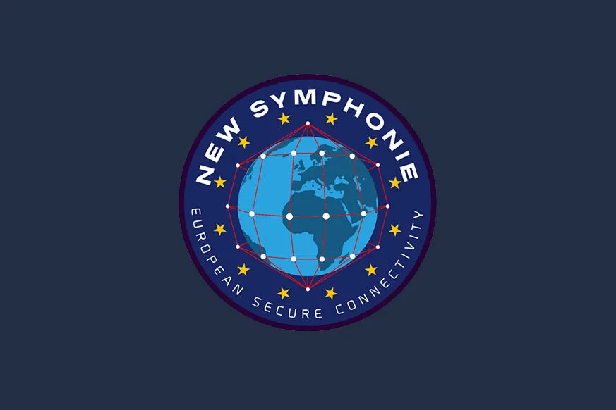 A circular mission patch for New Symphonie, a European secure connectivity initiative. The design features a stylized globe with interconnected red lines and white nodes, symbolizing a global satellite network. Surrounding the globe are twelve yellow stars, reminiscent of the European Union flag. The words "NEW SYMPHONIE" are displayed at the top, while "EUROPEAN SECURE CONNECTIVITY" is written along the bottom edge, emphasizing the project's focus on secure satellite communications. The patch is set against a dark blue background, reinforcing its European identity and technological significance.
